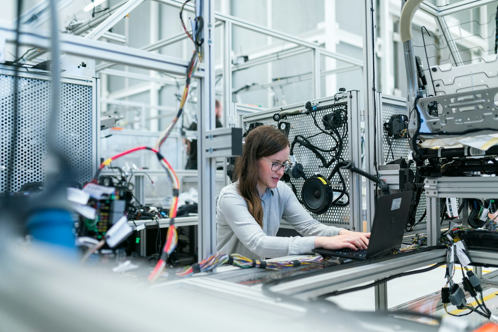 Engineer reviewing systems on a laptop